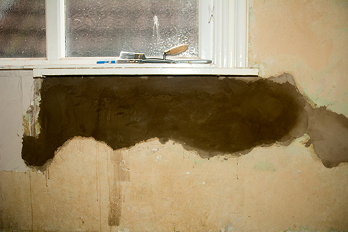 Cement patch under window