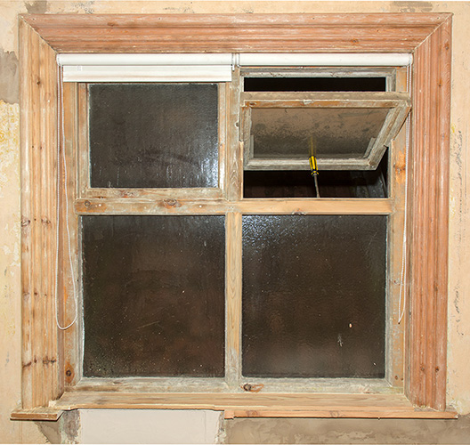Paint stripped window frame