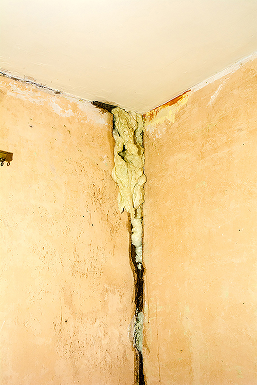 Gap in wall filled with expanding foam