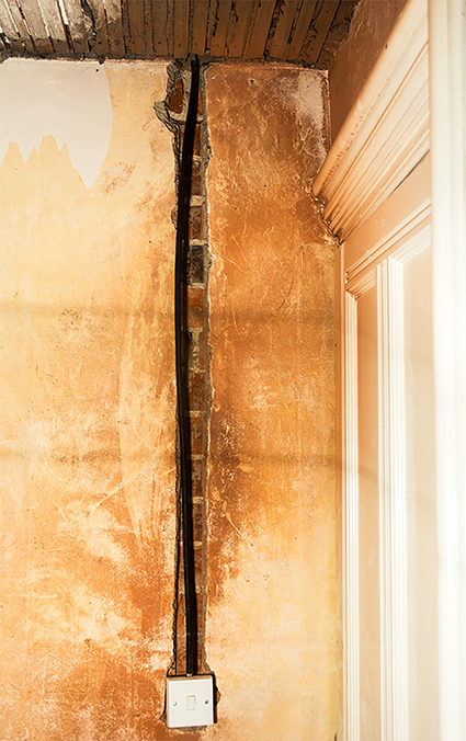 Conduit cut into wall